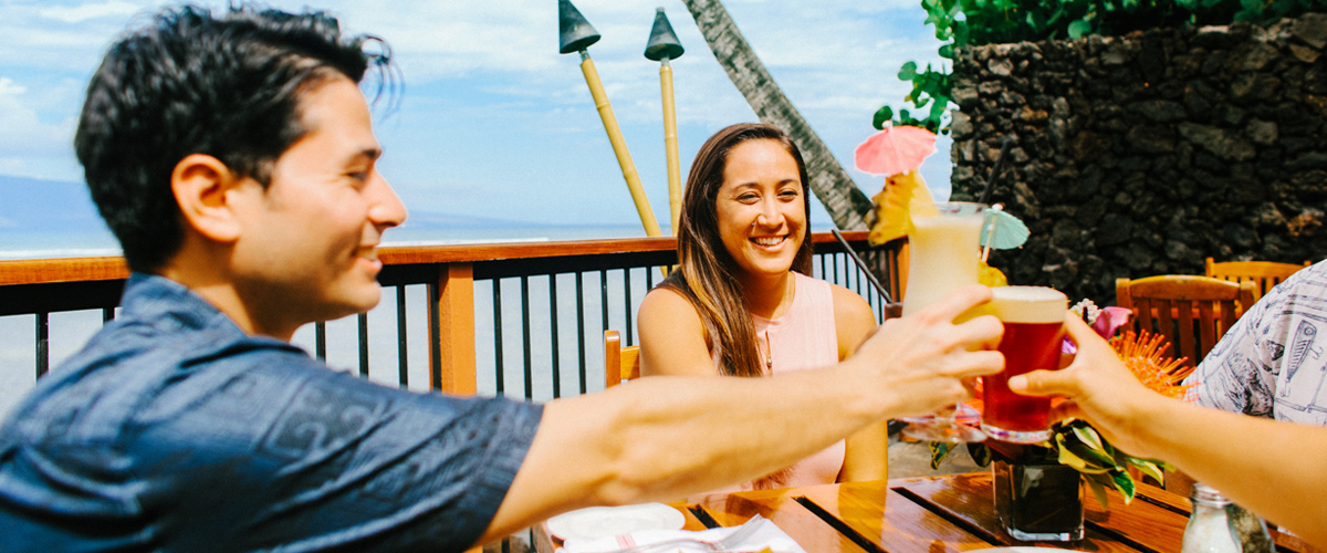 Friends enjoying the view and toasting their drinks