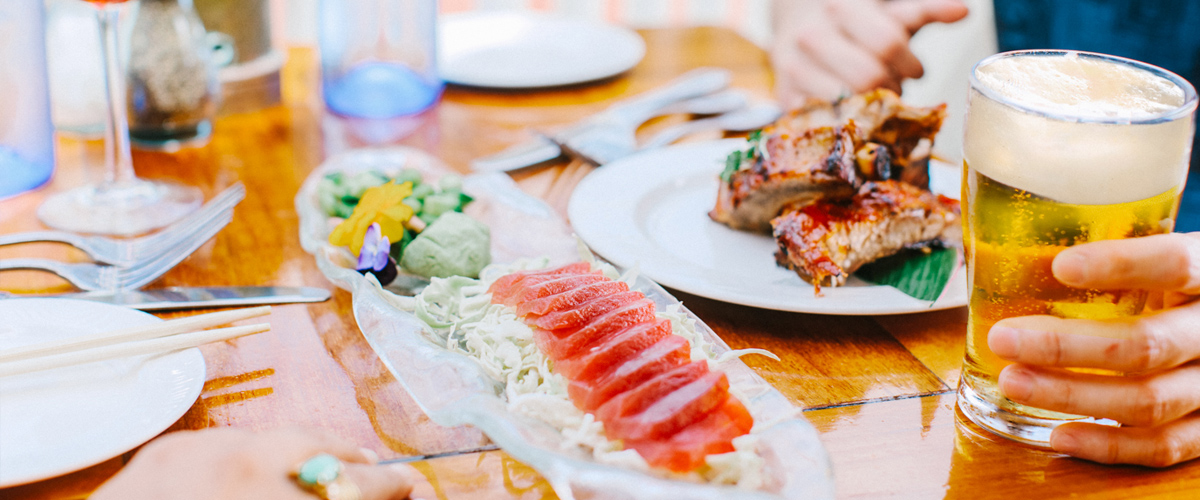 Dinner with fish, chicken, and a beer